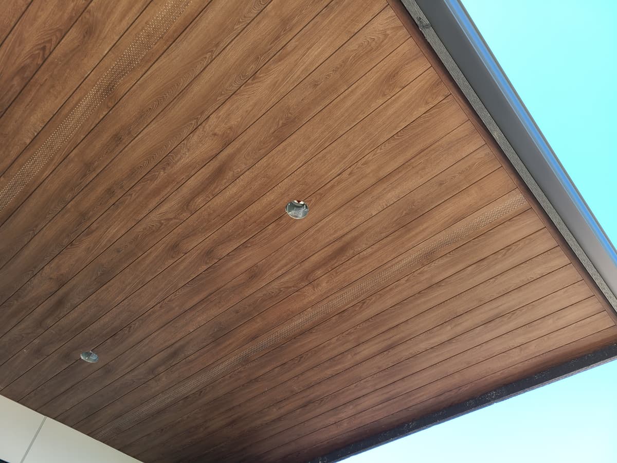 Wood plank soffit detail with recessed lighting